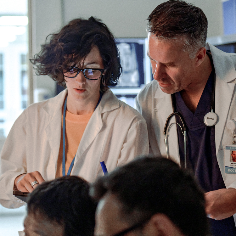 Two healthcare professionals reviewing data
