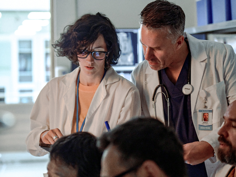 Two healthcare professionals reviewing data