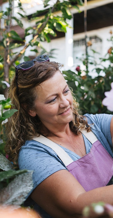 A woman pruning flowers