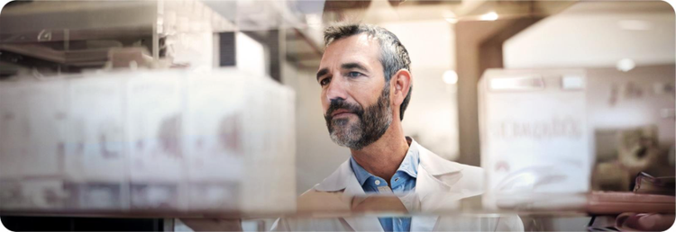 Pharmacist examining Pfizer prescription medication