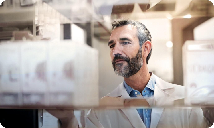 Pharmacist examining Pfizer prescription medication