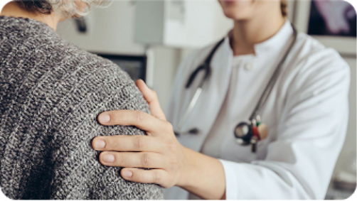 doctor offering support to patient while discussing migraine symptoms